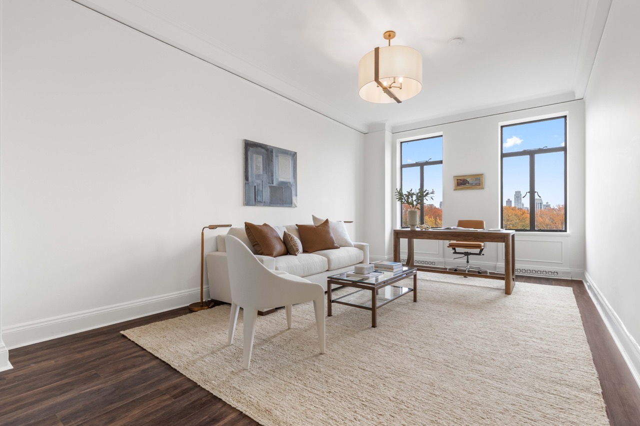 211 Central Park West, Unit 8E Manhattan, NY 10024 - Photo 8 of 14 a living room with furniture and a table