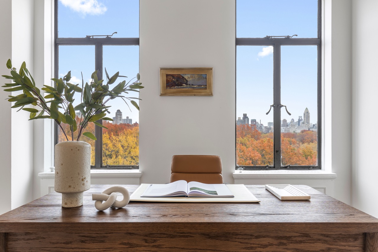 211 Central Park West, Unit 8E Manhattan, NY 10024 - Photo 9 of 14 a vase of flowers sitting on a table with window