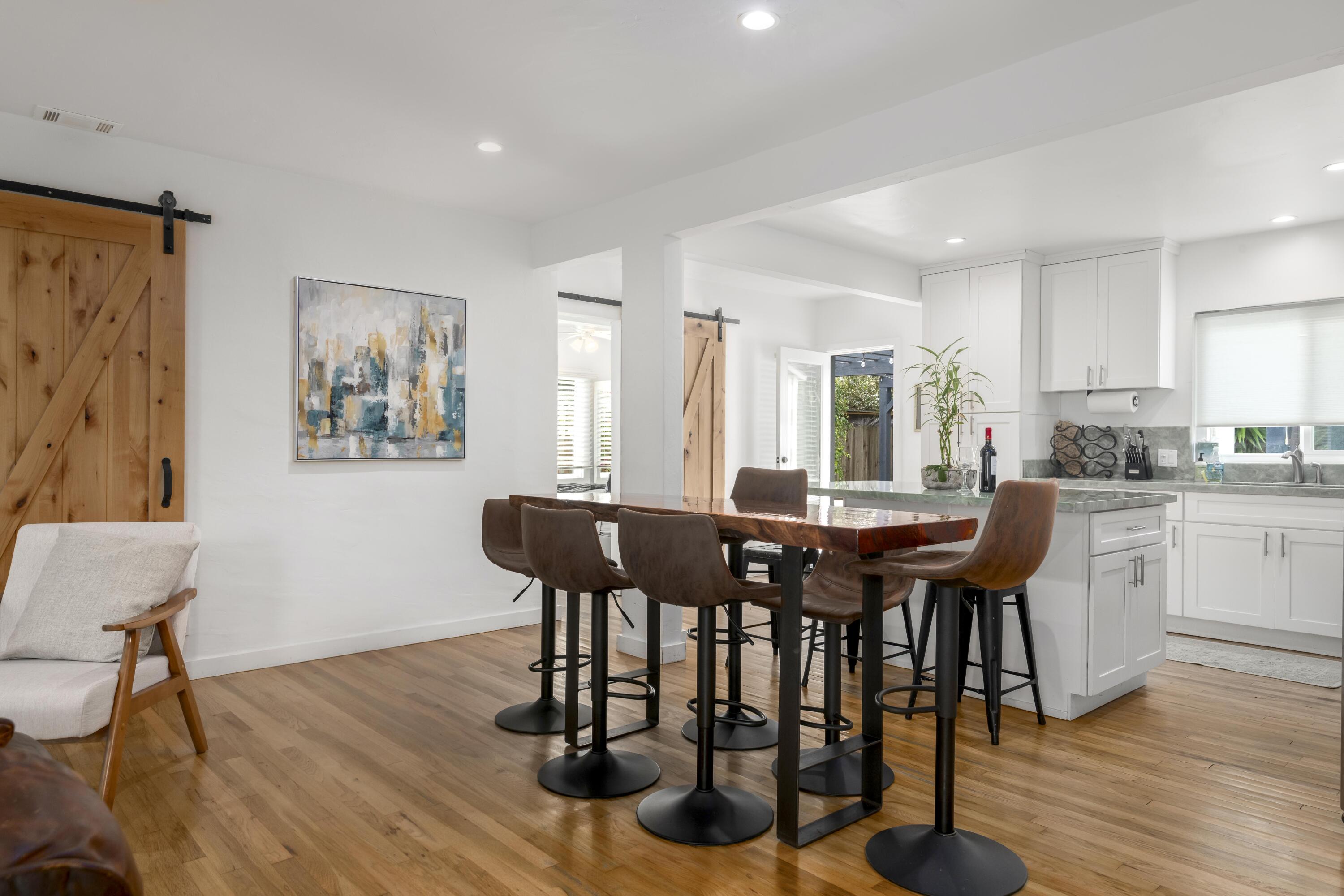1102 Del Mar Avenue Santa Barbara, CA 93109 - Photo 11 of 39 a view of a dining room with furniture and wooden floor