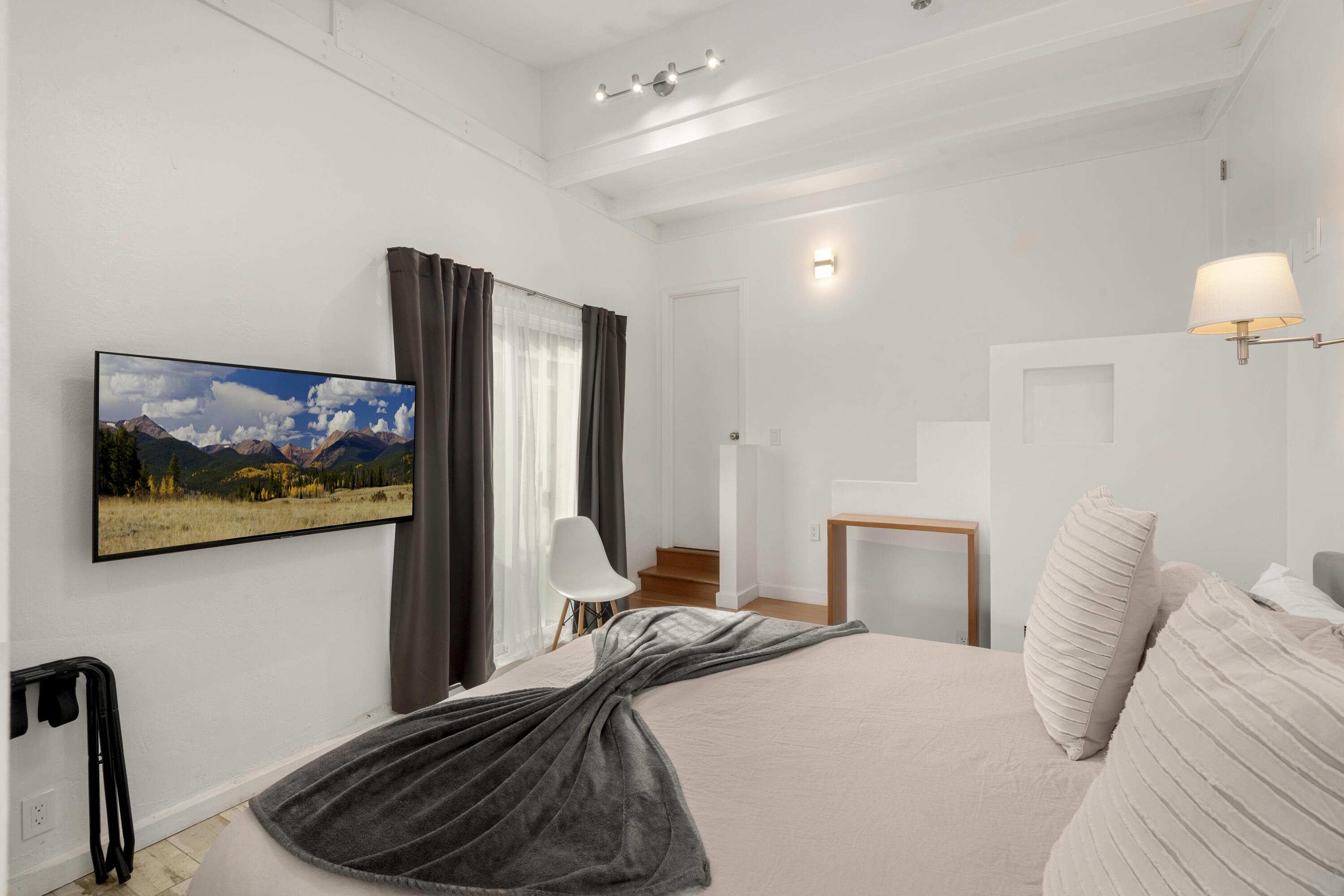 1102 Del Mar Avenue Santa Barbara, CA 93109 - Photo 15 of 39 a bedroom with a bed and a flat screen tv