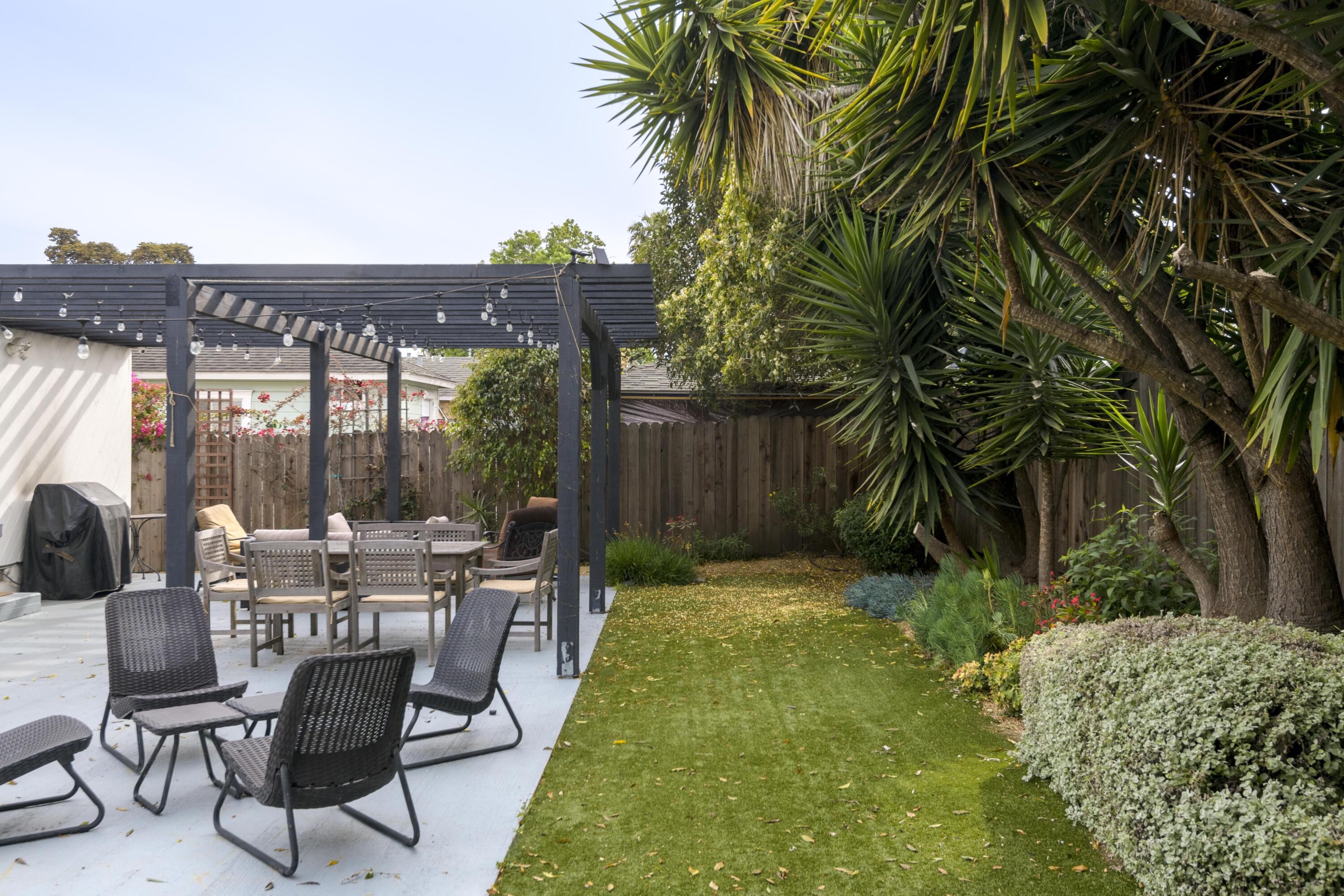 1102 Del Mar Avenue Santa Barbara, CA 93109 - Photo 24 of 39 a view of a patio with table and chairs and potted plants