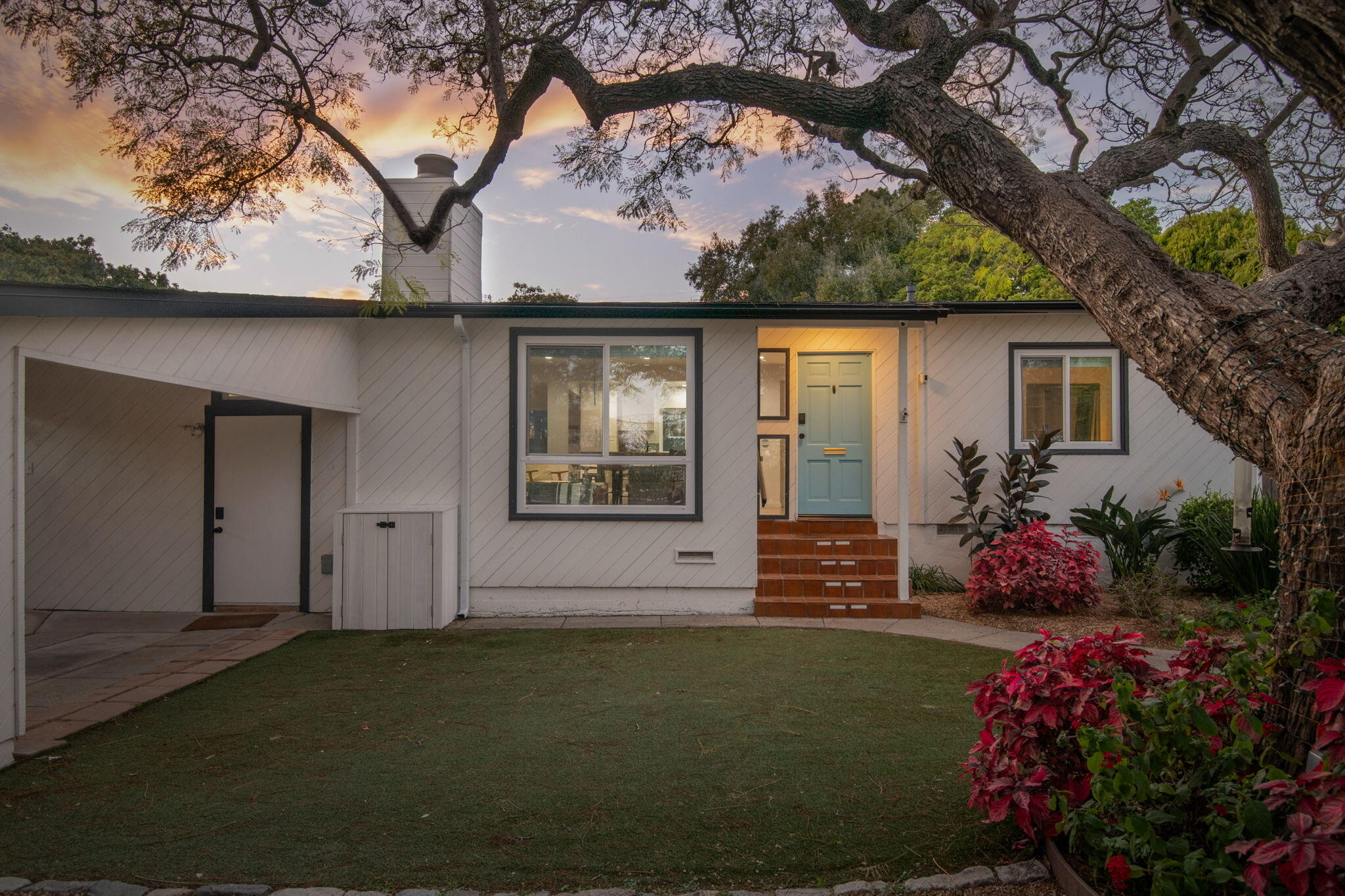 1102 Del Mar Avenue Santa Barbara, CA 93109 - Photo 4 of 39 a front view of a house with a garden