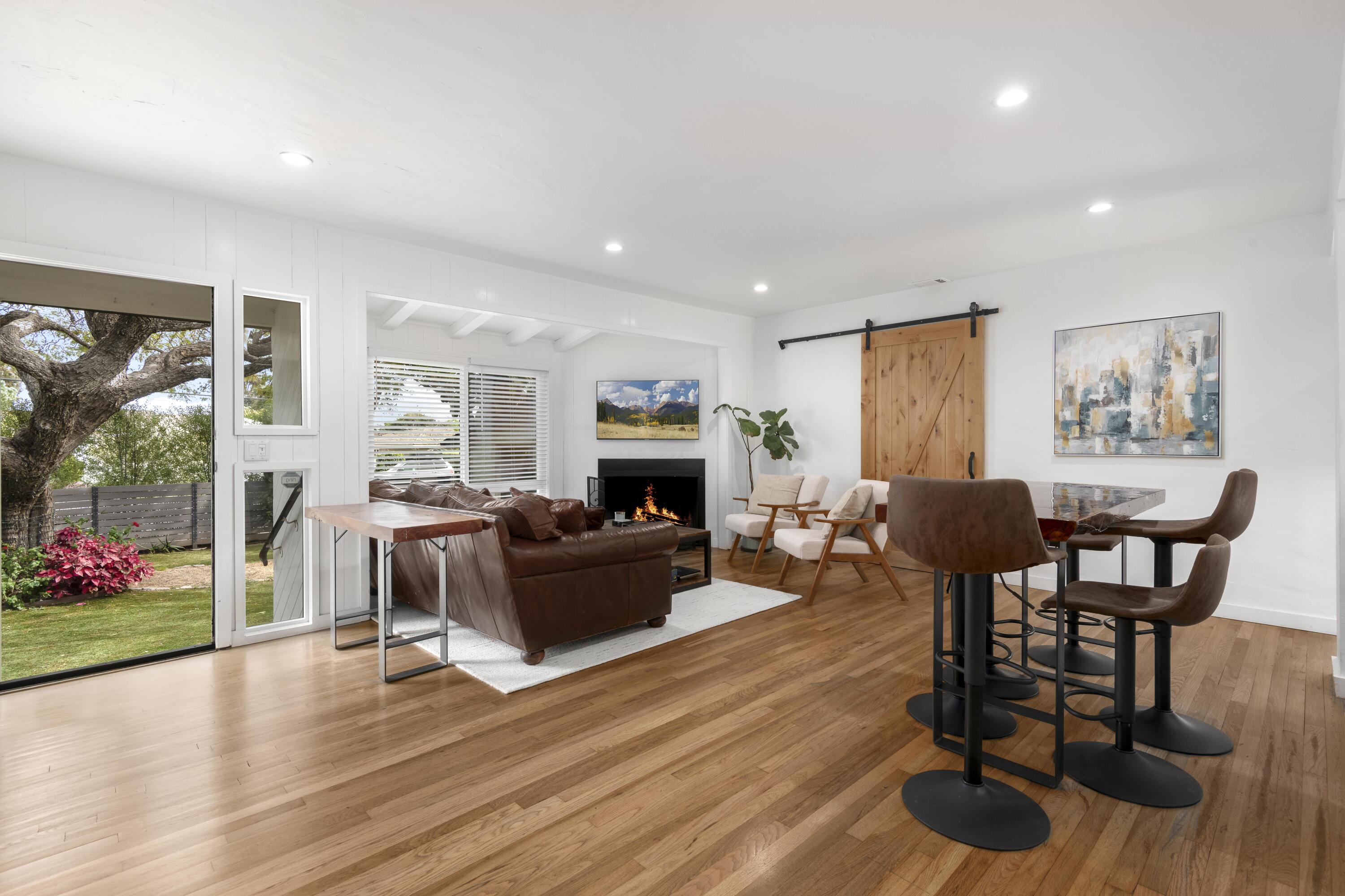 1102 Del Mar Avenue Santa Barbara, CA 93109 - Photo 7 of 39 a living room with furniture and a fireplace