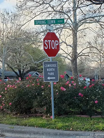 a street sign on a pole on a street