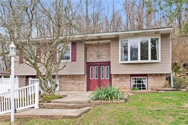 front view of a house with a yard