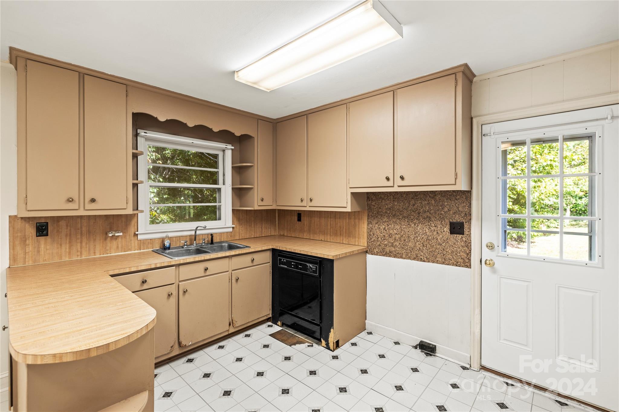 3255 Mack Ballard Road Maiden, NC 28650 - Photo 8 of 20 a kitchen with a sink a stove a window and cabinets