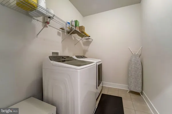 a view of a room with exposed radiator and a window