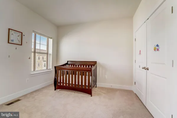 a view of a livingroom with a furniture and staircase