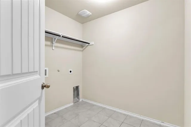 a view of green field with house in the background