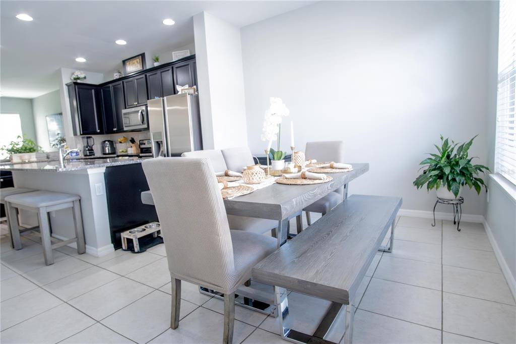11636 Water Run Alley Windermere, FL 34786 - Photo 7 of 18 a view of a dining room with furniture