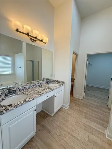 a bathroom with a glass shower door