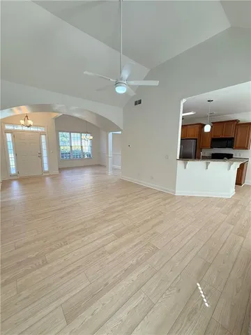 a kitchen with stainless steel appliances granite countertop a sink refrigerator and microwave