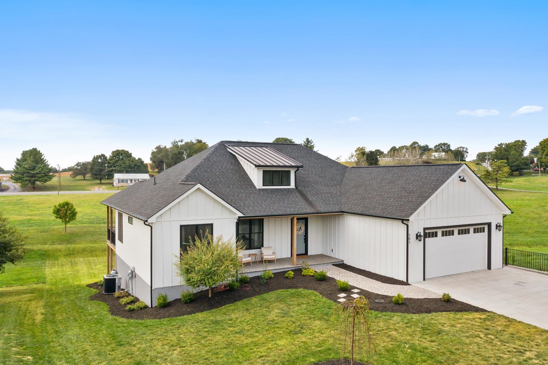 a view of a house with a yard