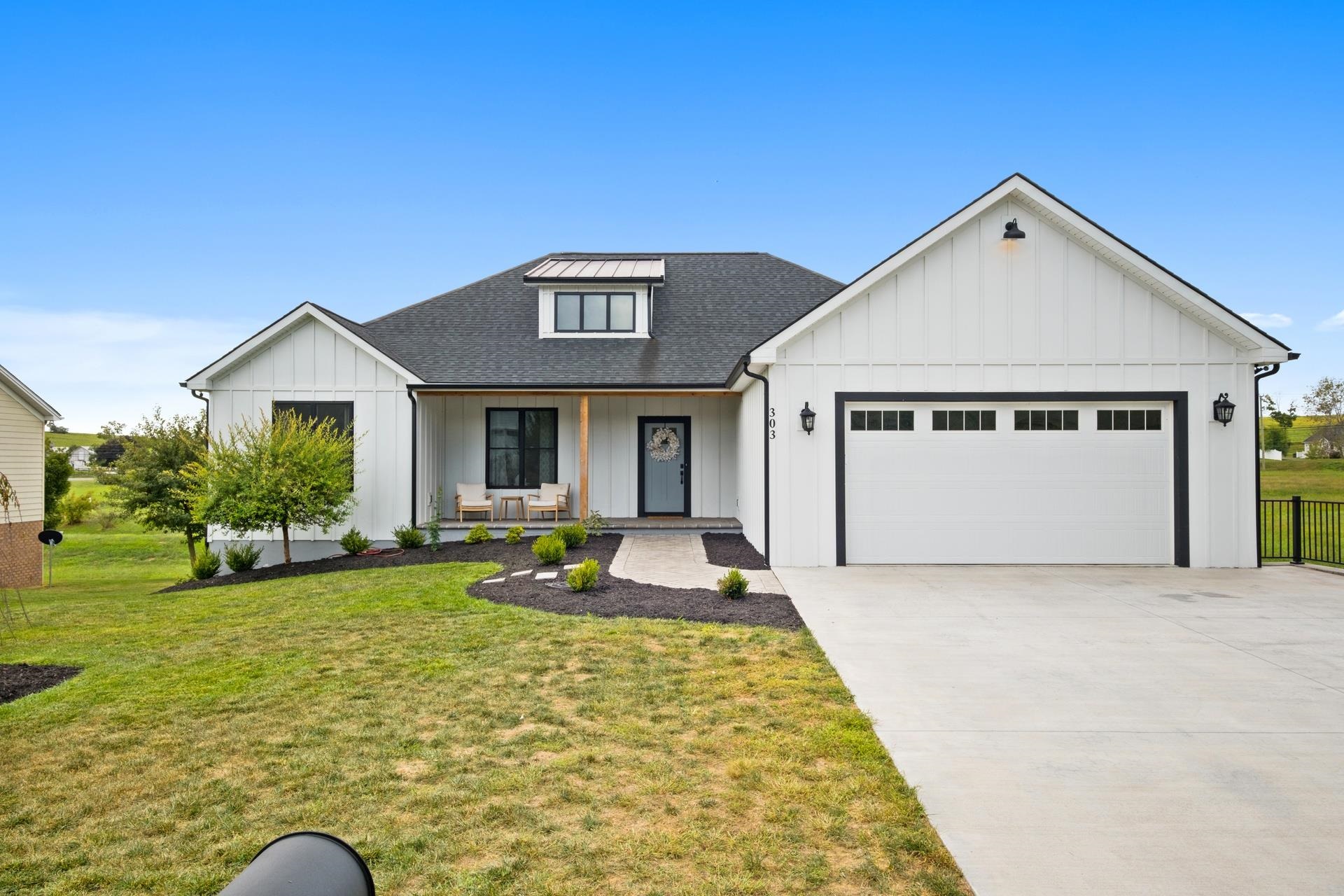 303 Bartley Street Dayton, VA 22821 - Photo 2 of 47 a front view of a house with a yard outdoor seating and yard