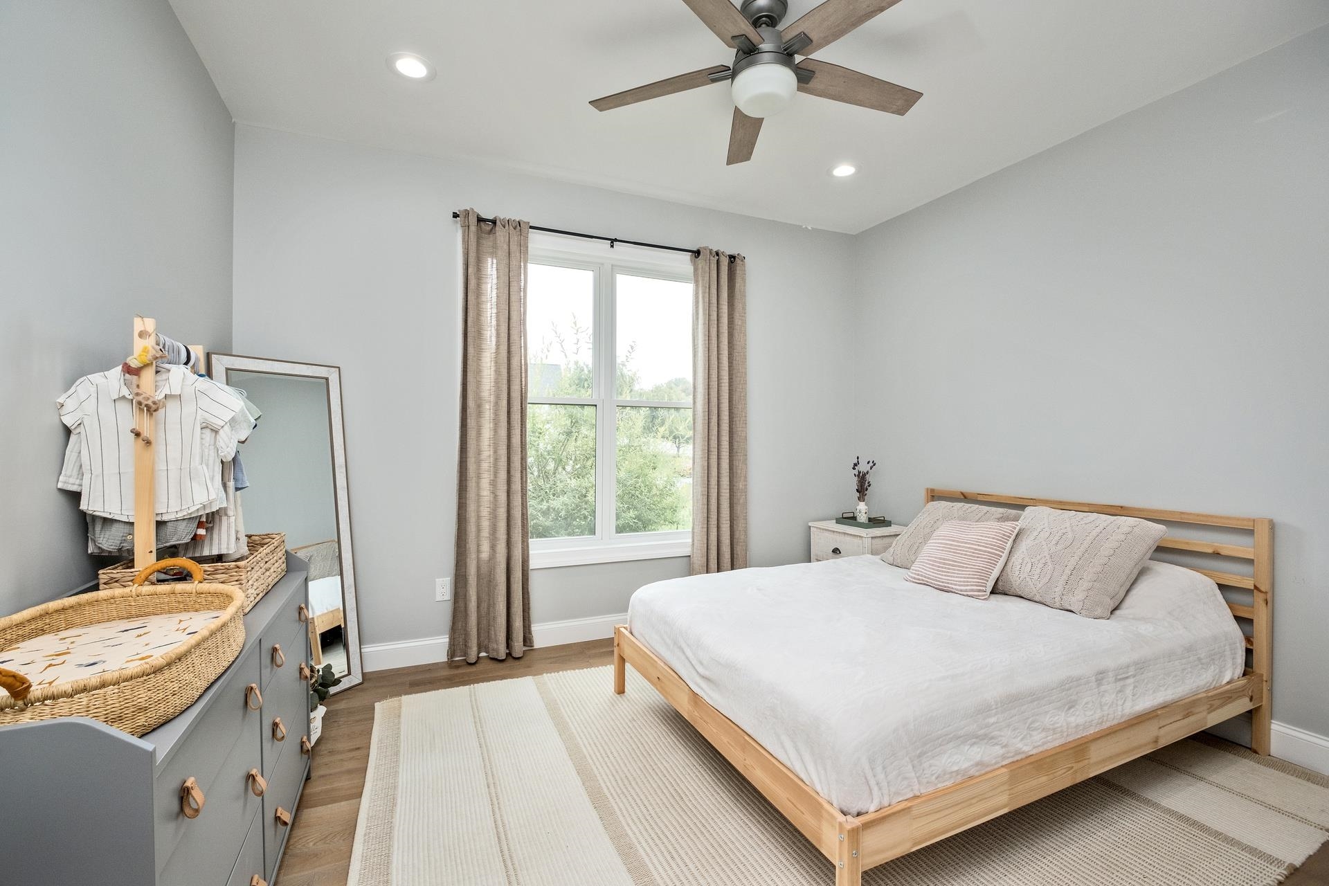 303 Bartley Street Dayton, VA 22821 - Photo 29 of 47 a bedroom with a bed and a chandelier