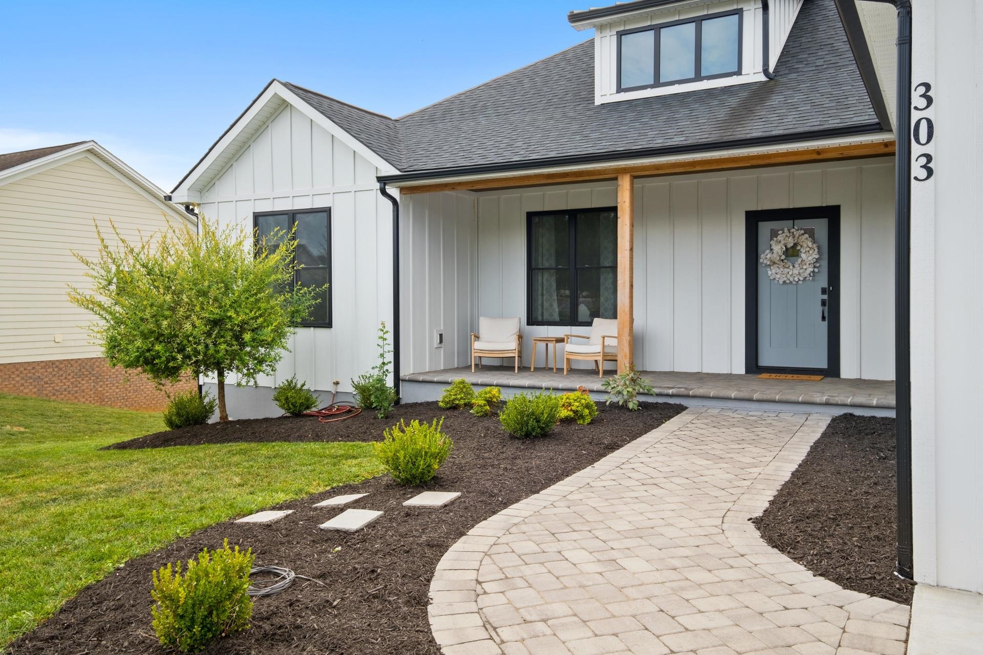 303 Bartley Street Dayton, VA 22821 - Photo 3 of 47 a front view of a house with a yard and porch