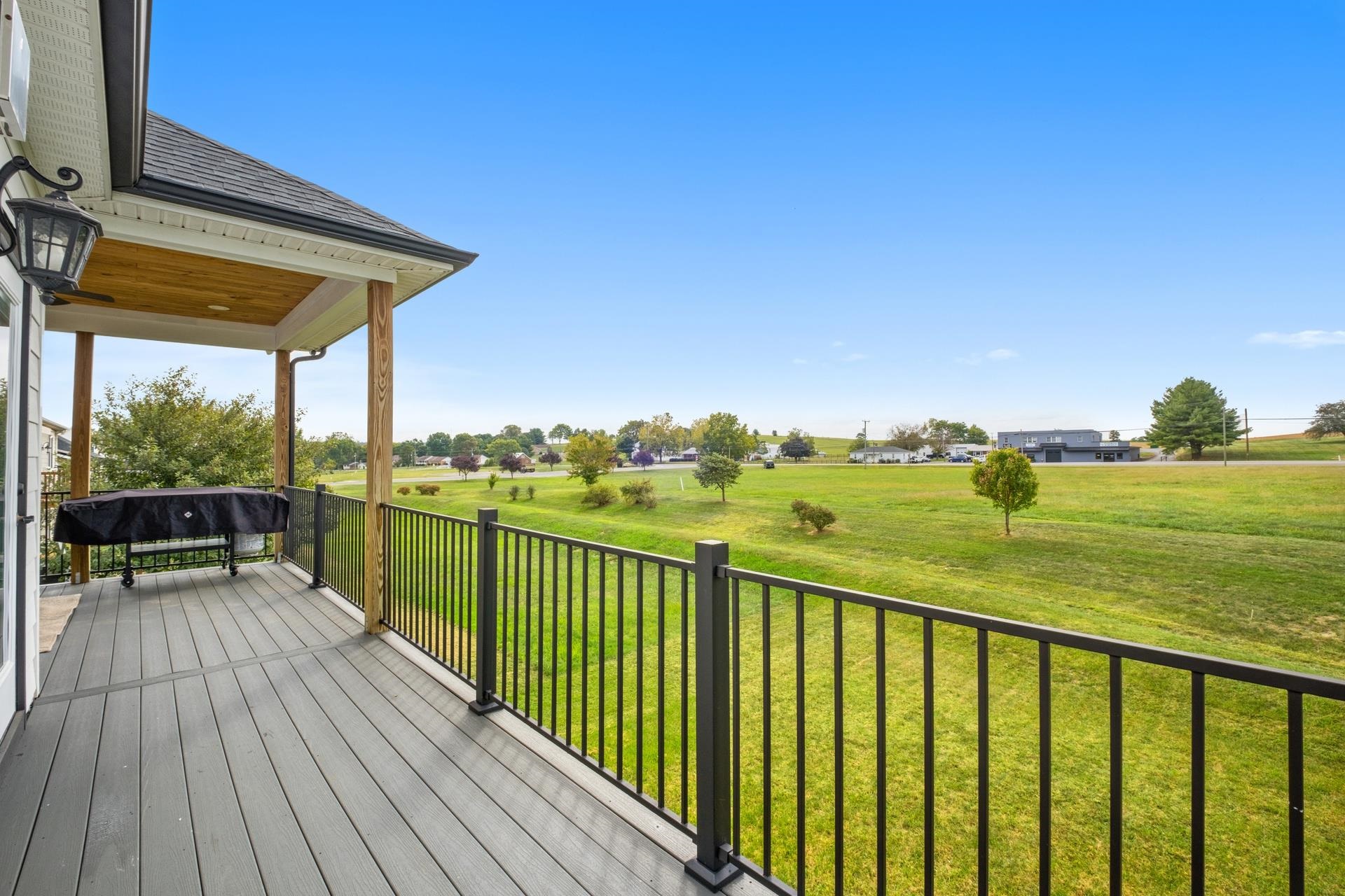 303 Bartley Street Dayton, VA 22821 - Photo 37 of 47 a view of a balcony with wooden floor and fence