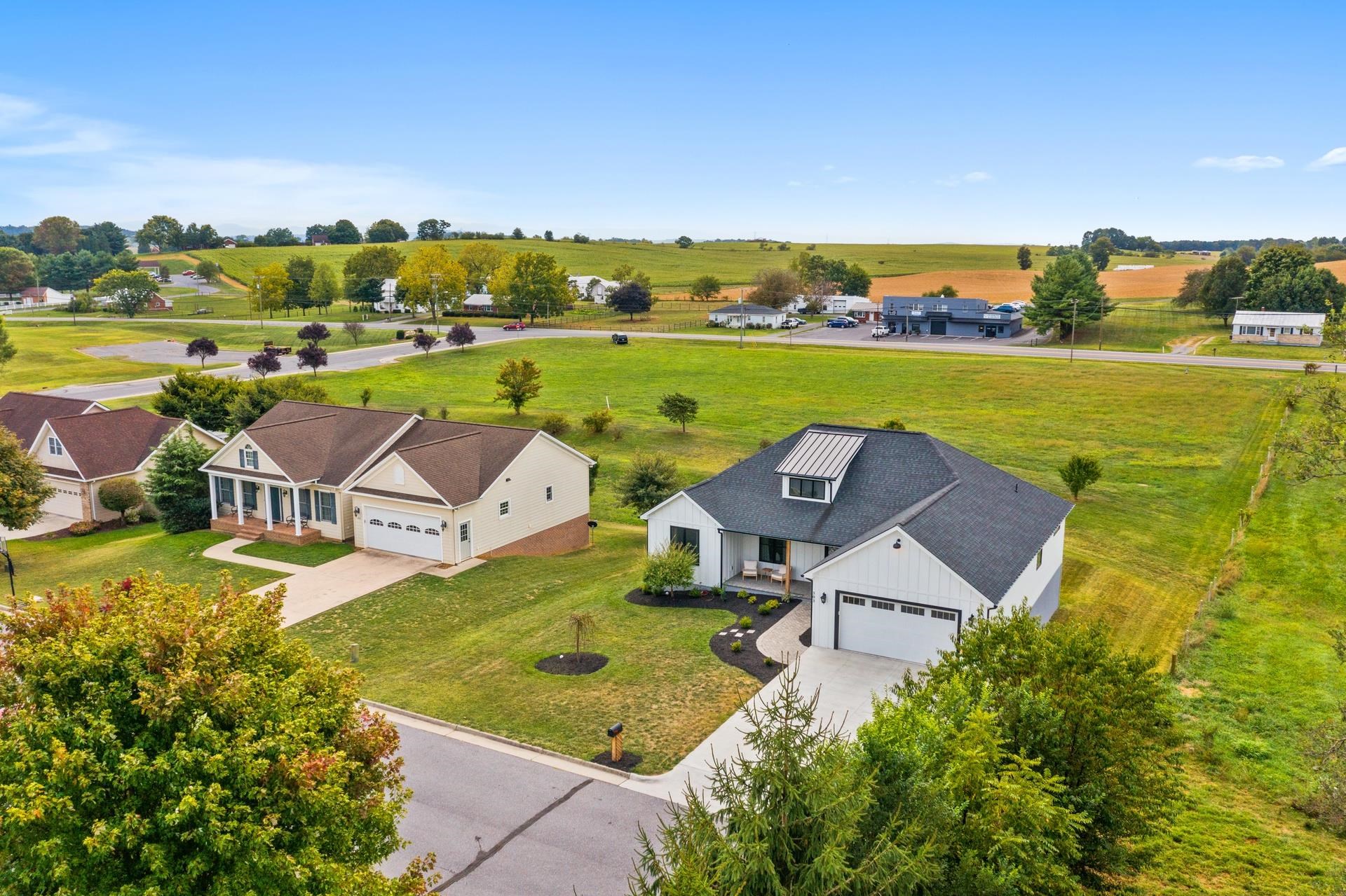 303 Bartley Street Dayton, VA 22821 - Photo 43 of 47 an aerial view of residential houses with outdoor space and ocean view