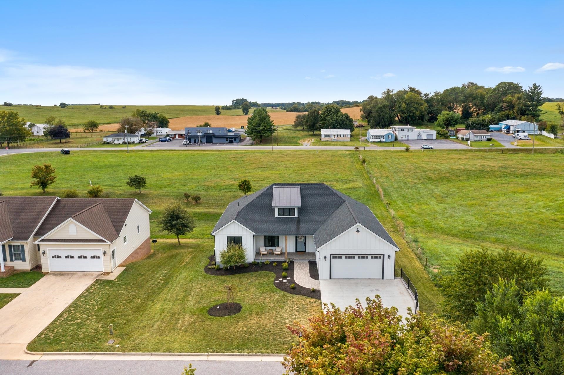 303 Bartley Street Dayton, VA 22821 - Photo 44 of 47 an aerial view of a house with big yard and large trees