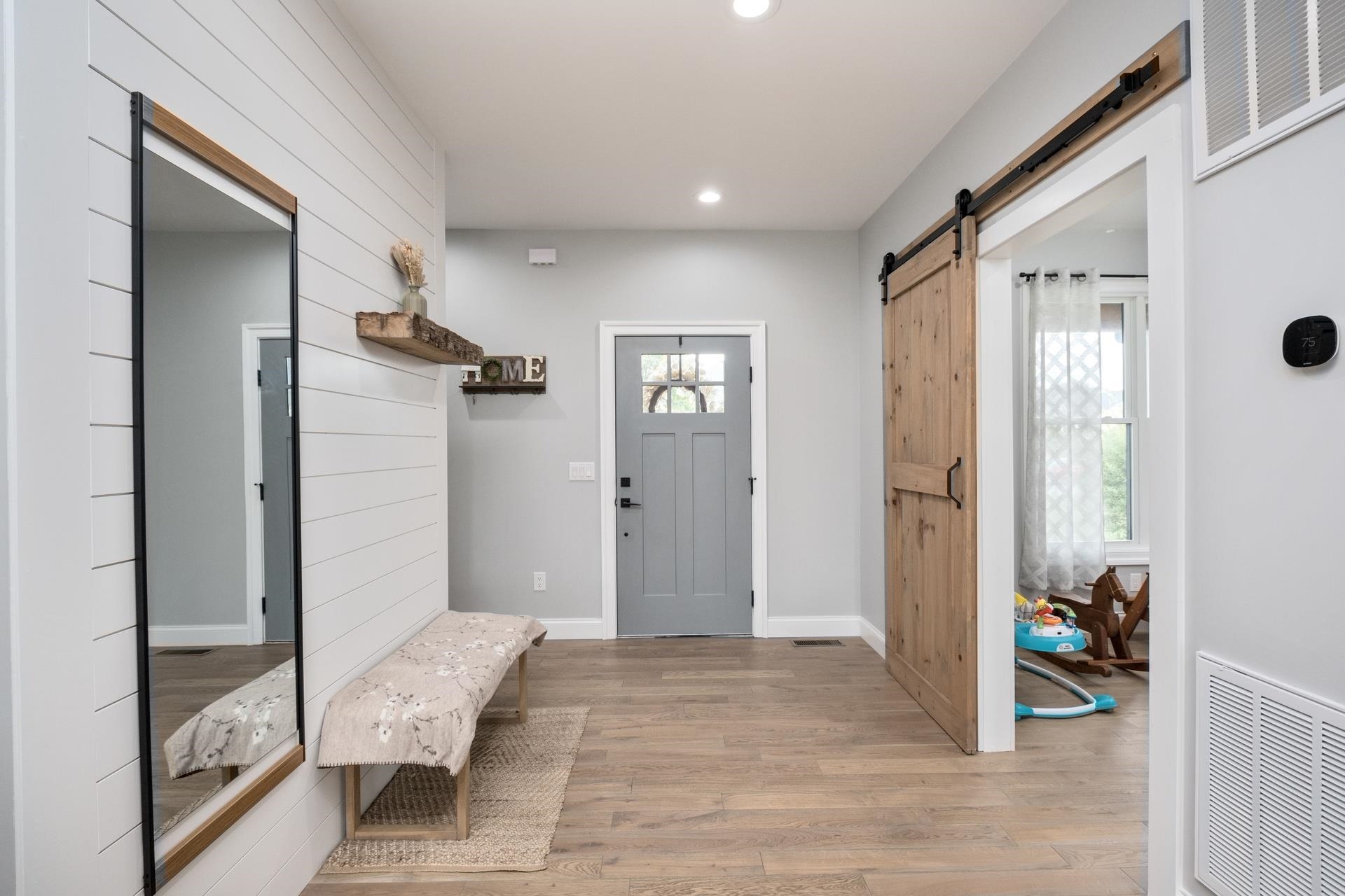 303 Bartley Street Dayton, VA 22821 - Photo 6 of 47 a view of livingroom with hardwood floor and bathroom