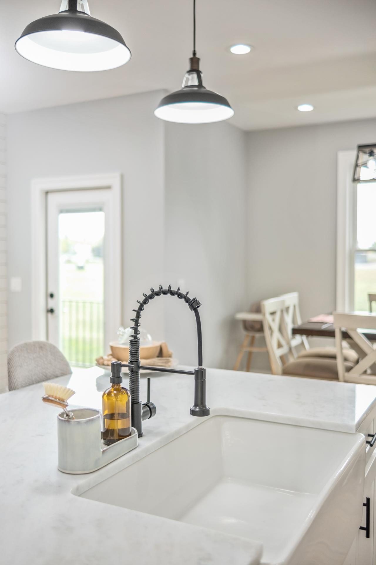 303 Bartley Street Dayton, VA 22821 - Photo 8 of 47 a kitchen with a faucet a chandelier and living room view