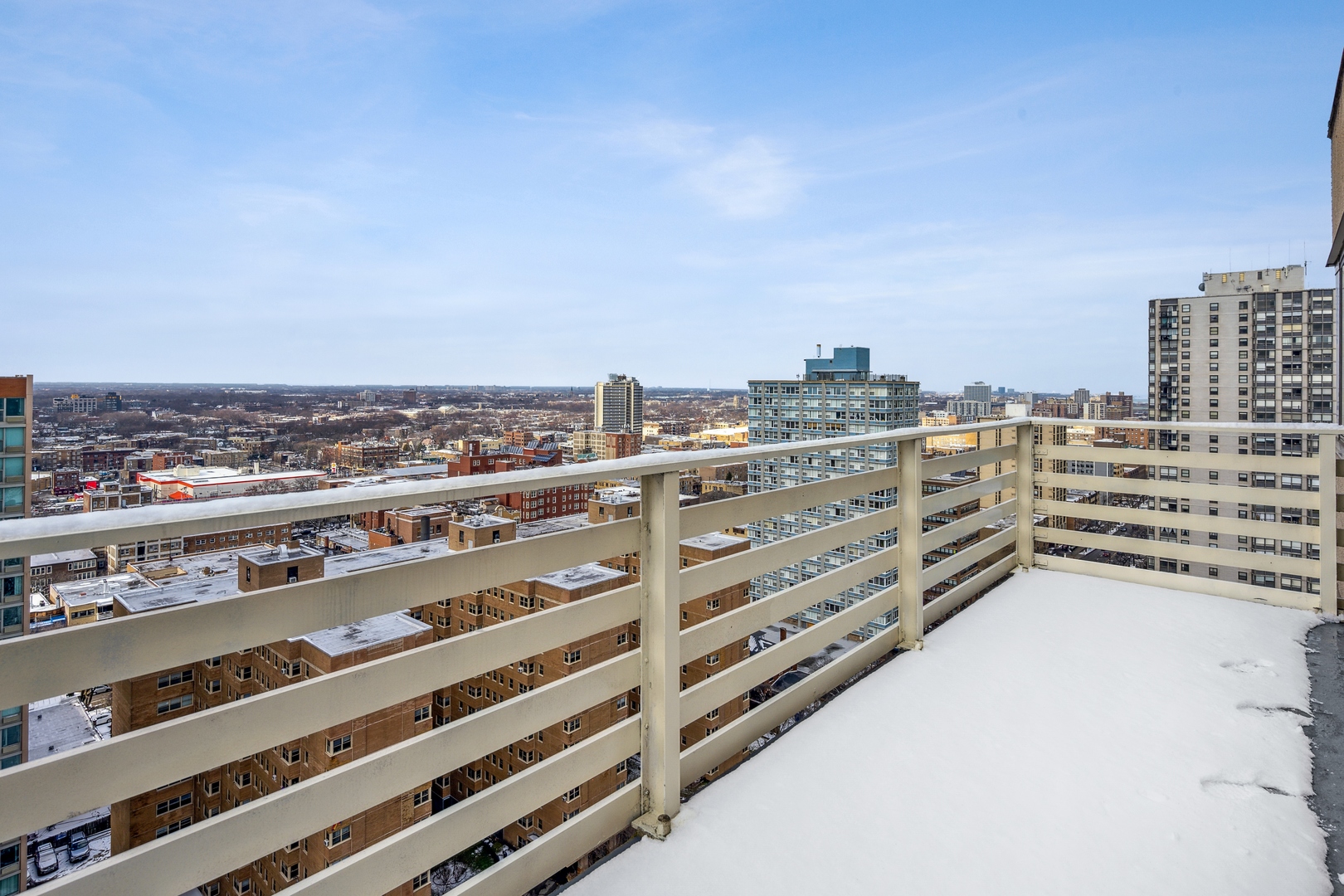 5601 North Sheridan Road, Unit 21E Chicago, IL 60660 - Photo 22 of 27 a view of a city with tall buildings