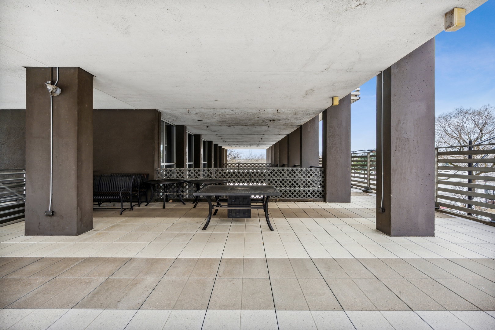 5601 North Sheridan Road, Unit 21E Chicago, IL 60660 - Photo 27 of 27 a backyard of a house with yard and furniture