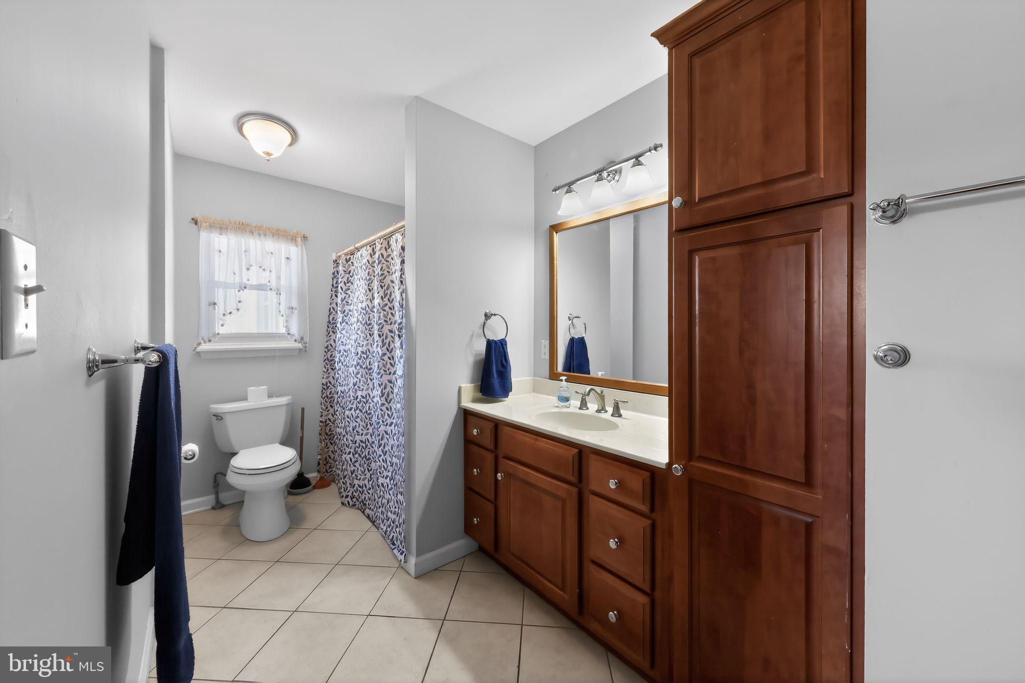 214 Bluefield Road Newark, DE 19713 - Photo 19 of 28 a bathroom with a double vanity sink toilet and shower