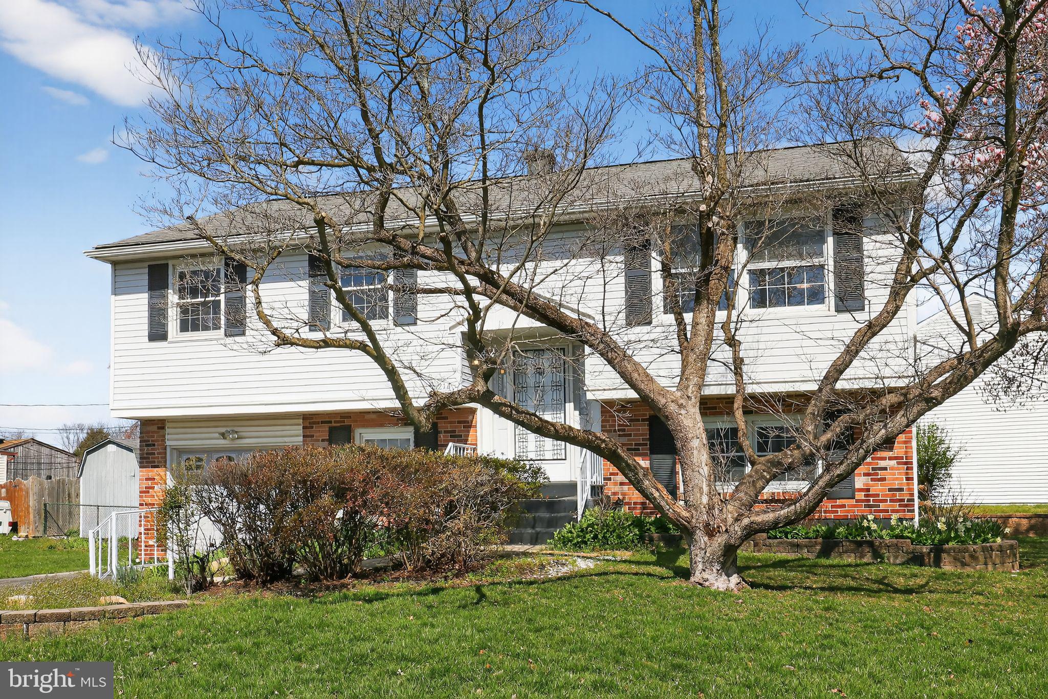 214 Bluefield Road Newark, DE 19713 - Photo 2 of 28 a front view of a house with a yard