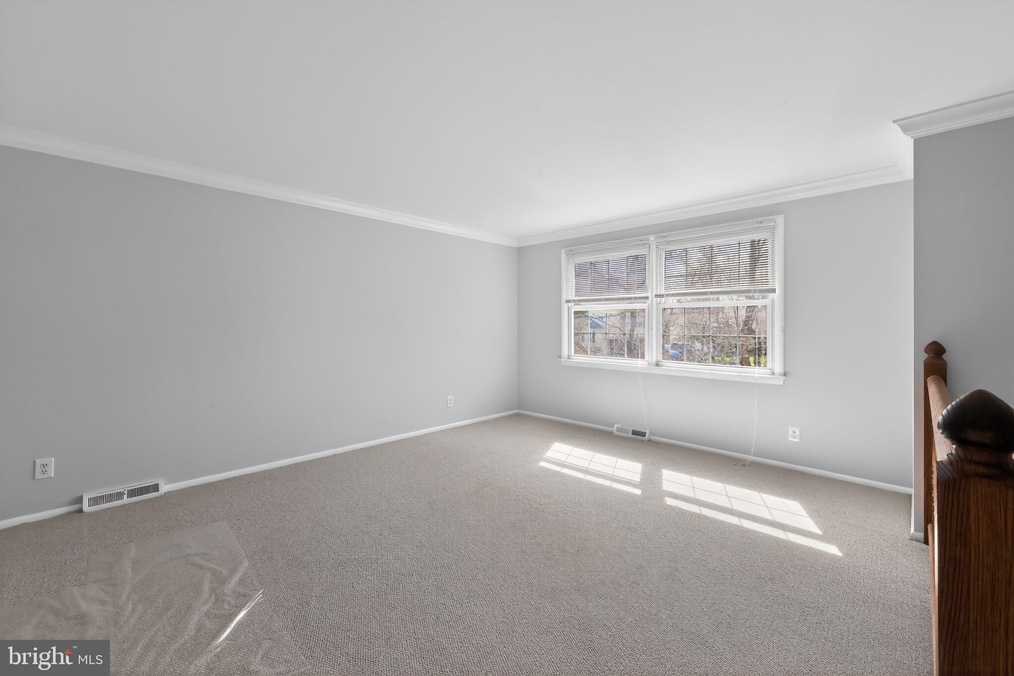 214 Bluefield Road Newark, DE 19713 - Photo 5 of 28 an empty room with windows