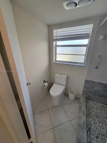 a bathroom with a toilet