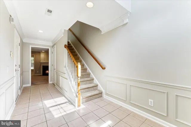 a view of entryway with stairs and a rug