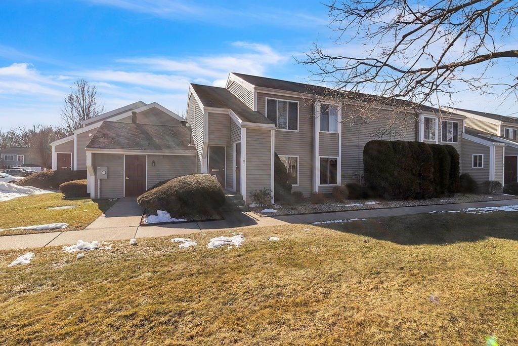 103 Nassau Drive, Unit 103 Springfield, MA 01129 - Photo 1 of 25 a view of a house with backyard and sitting area