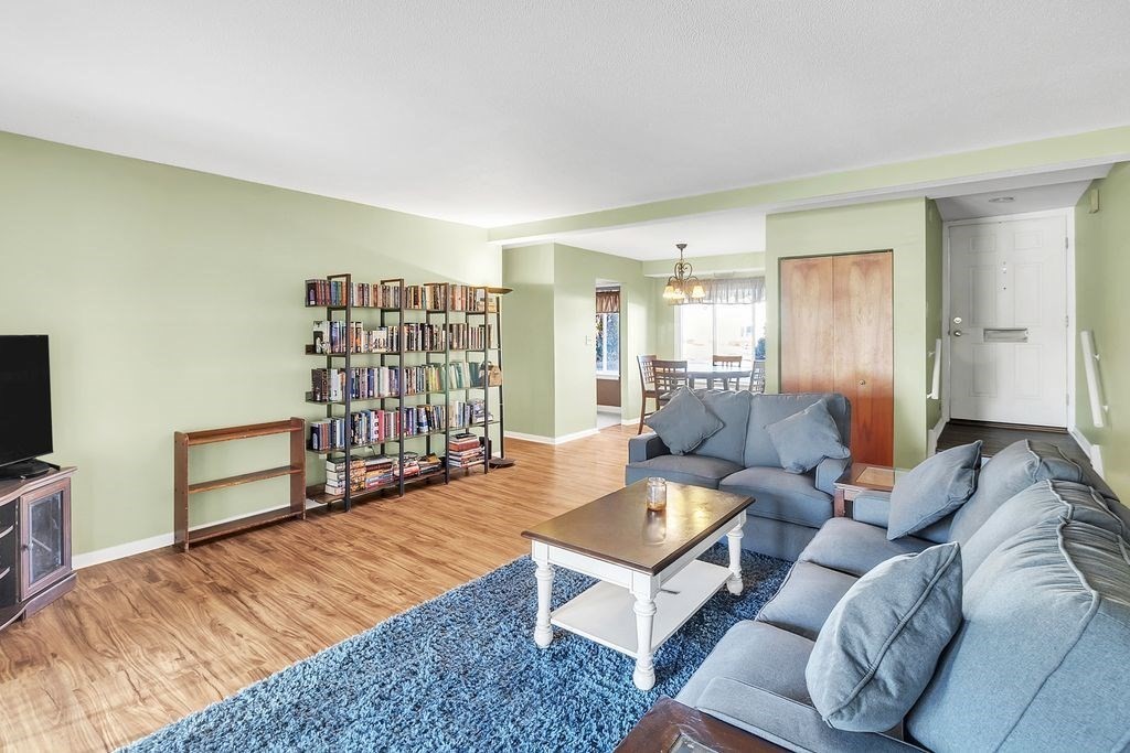 103 Nassau Drive, Unit 103 Springfield, MA 01129 - Photo 12 of 25 a living room with furniture and a flat screen tv