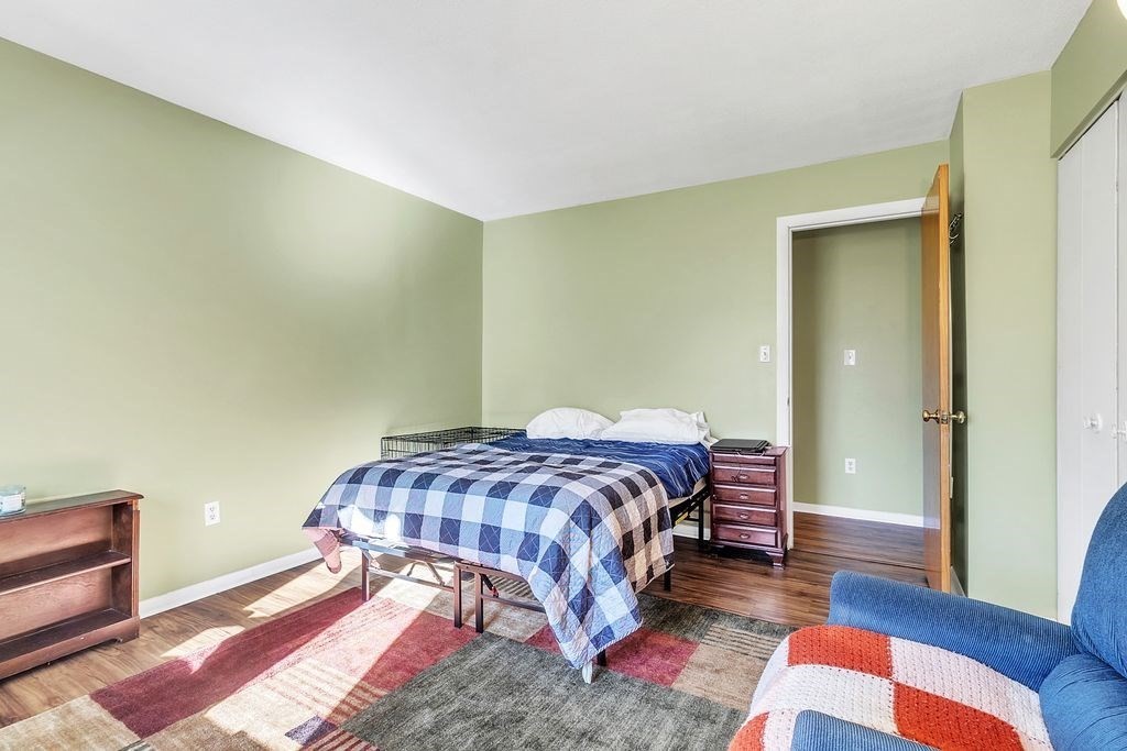 103 Nassau Drive, Unit 103 Springfield, MA 01129 - Photo 19 of 25 a bedroom with a bed and a couch