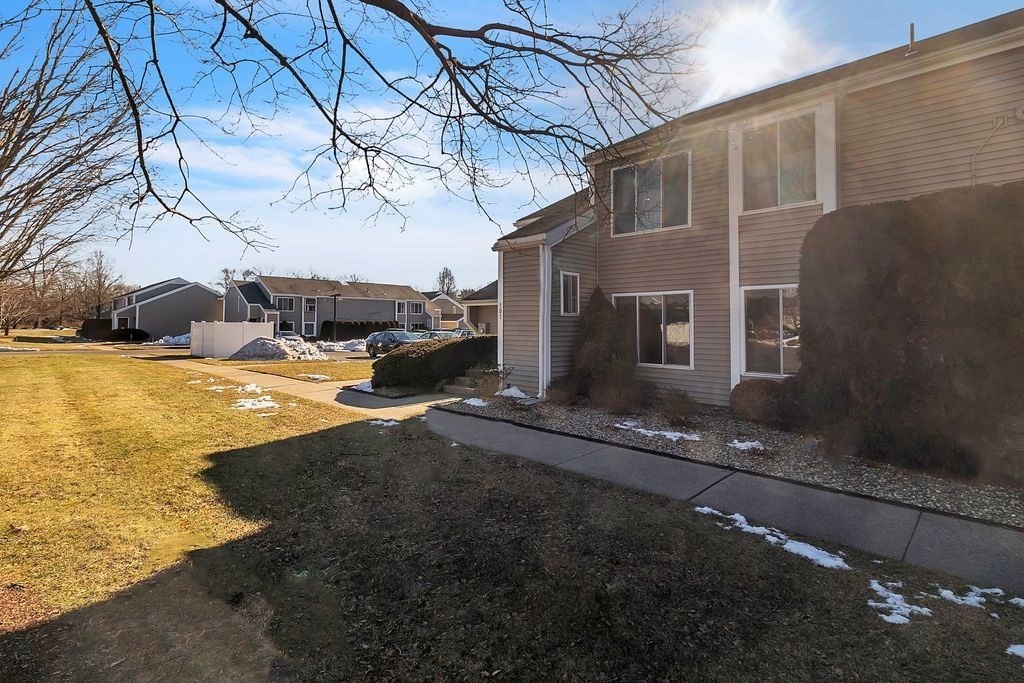 103 Nassau Drive, Unit 103 Springfield, MA 01129 - Photo 10 of 25 a view of a house with backyard and sitting area