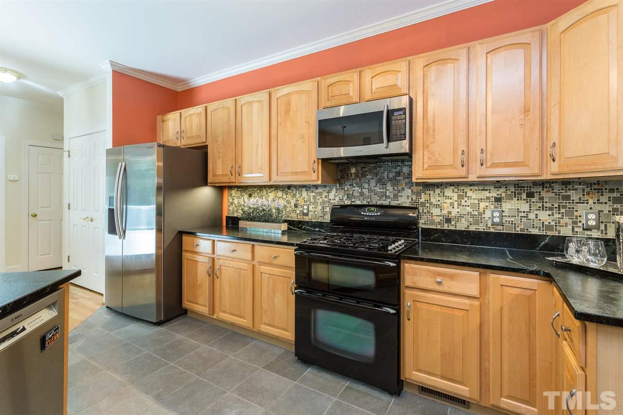 2537 Mt Vernon Church Road Raleigh, NC 27614 - Photo 12 of 30 a kitchen with stainless steel appliances granite countertop a stove a sink and a microwave