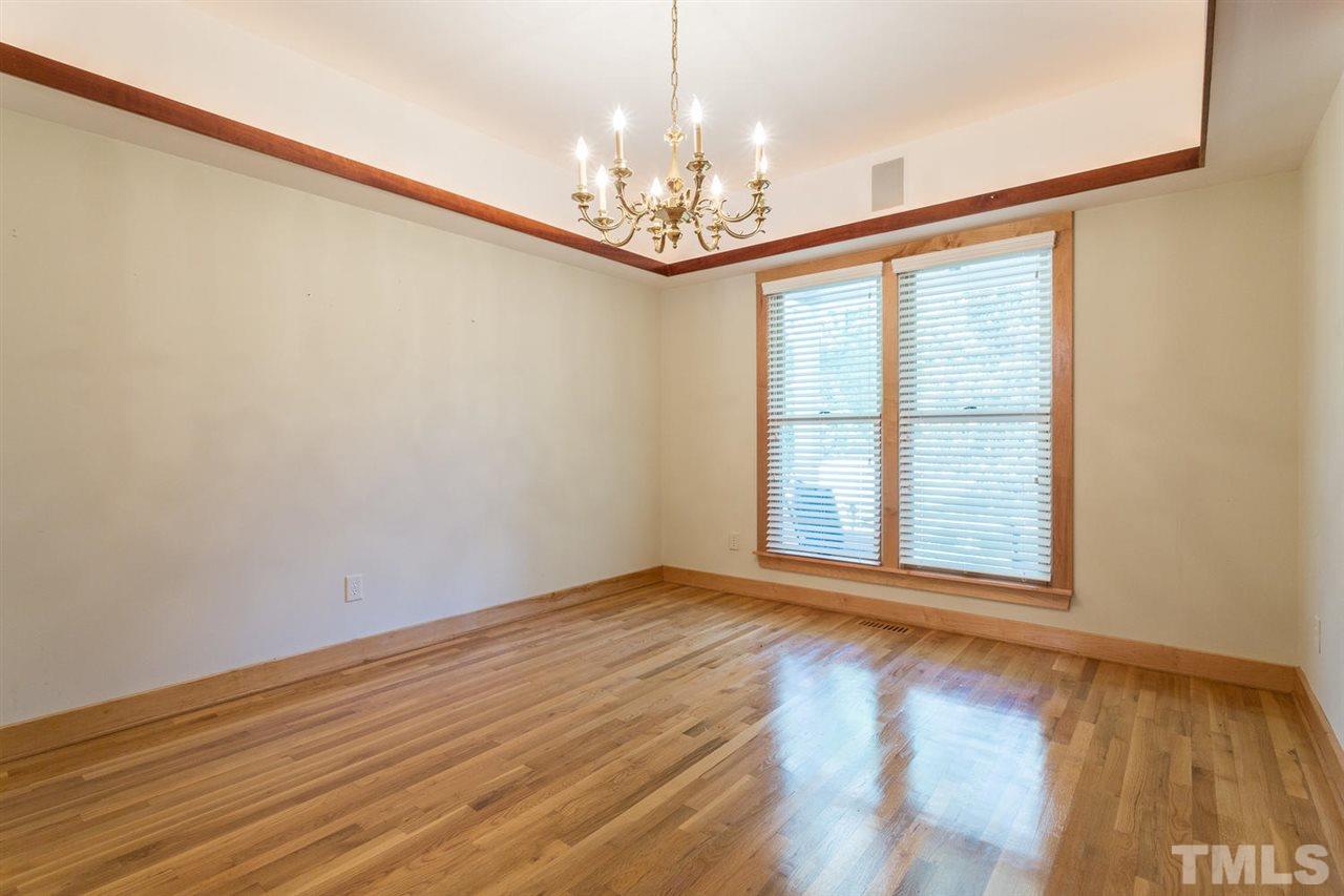 2537 Mt Vernon Church Road Raleigh, NC 27614 - Photo 15 of 30 a view of an empty room with window and wooden floor