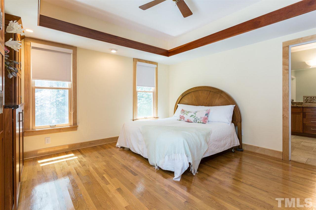 2537 Mt Vernon Church Road Raleigh, NC 27614 - Photo 16 of 30 a bedroom with a bed and a large window