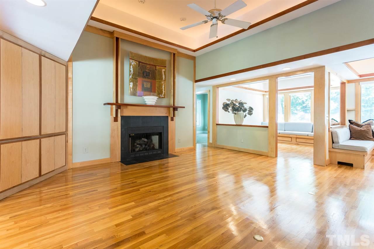 2537 Mt Vernon Church Road Raleigh, NC 27614 - Photo 7 of 30 a view of an empty room with a fireplace and a window