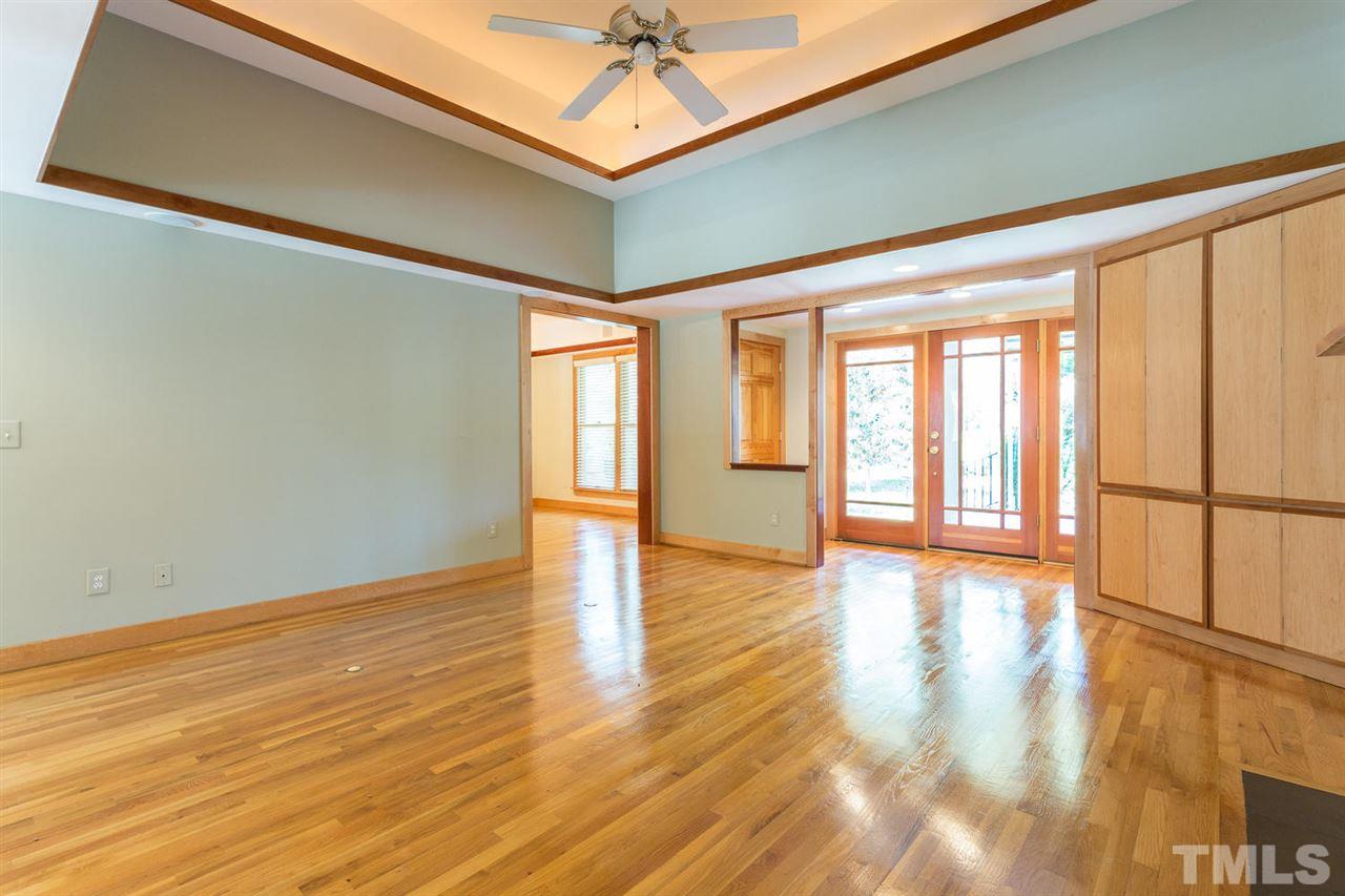 2537 Mt Vernon Church Road Raleigh, NC 27614 - Photo 9 of 30 a view of an empty room with a window and wooden floor