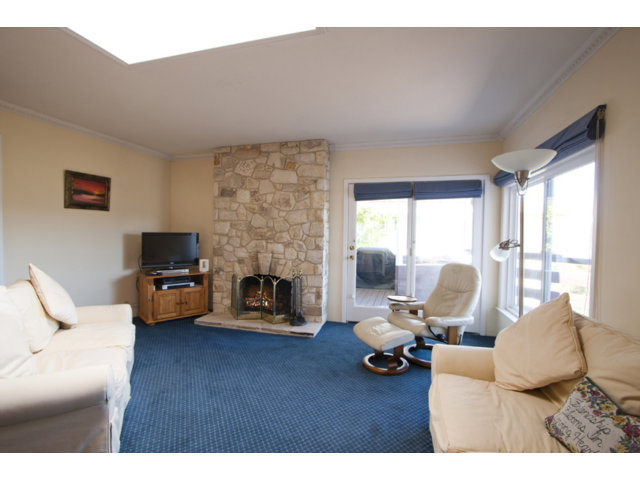 2995 Ribera Road Carmel, CA 93923 - Photo 6 of 16 a living room with furniture and a fireplace