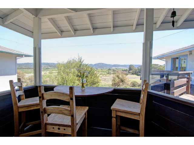 2995 Ribera Road Carmel, CA 93923 - Photo 10 of 16 a dining room with furniture window and wooden floor