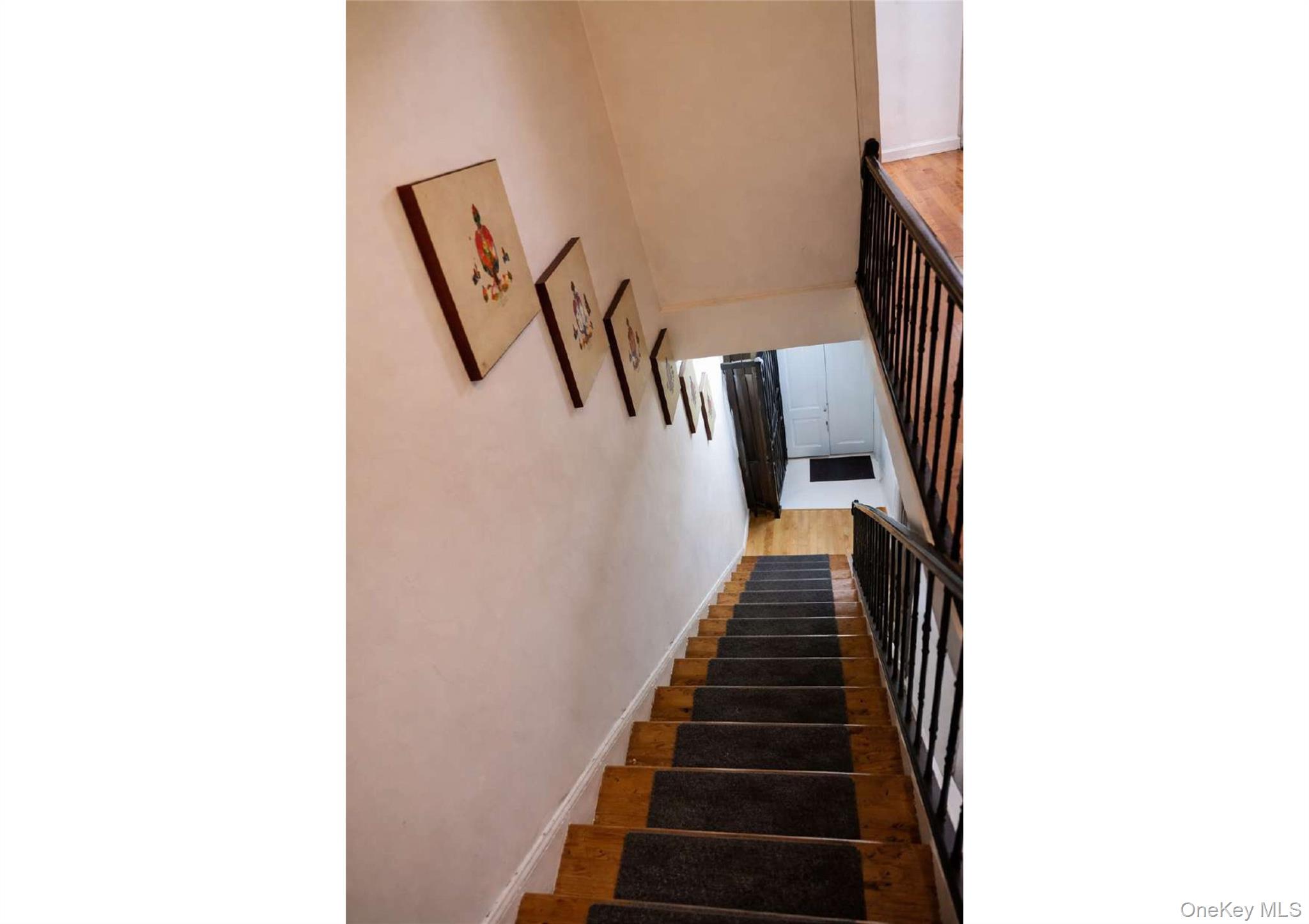 85-40 79th Street Queens, NY 11421 - Photo 14 of 19 Stairway with wood finished floors