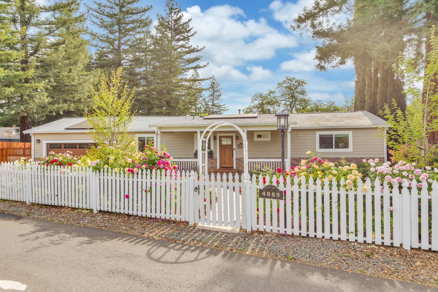 4885 Racetrack Road Rocklin, CA 95677 - Photo 1 of 1 a front view of a house with a garden