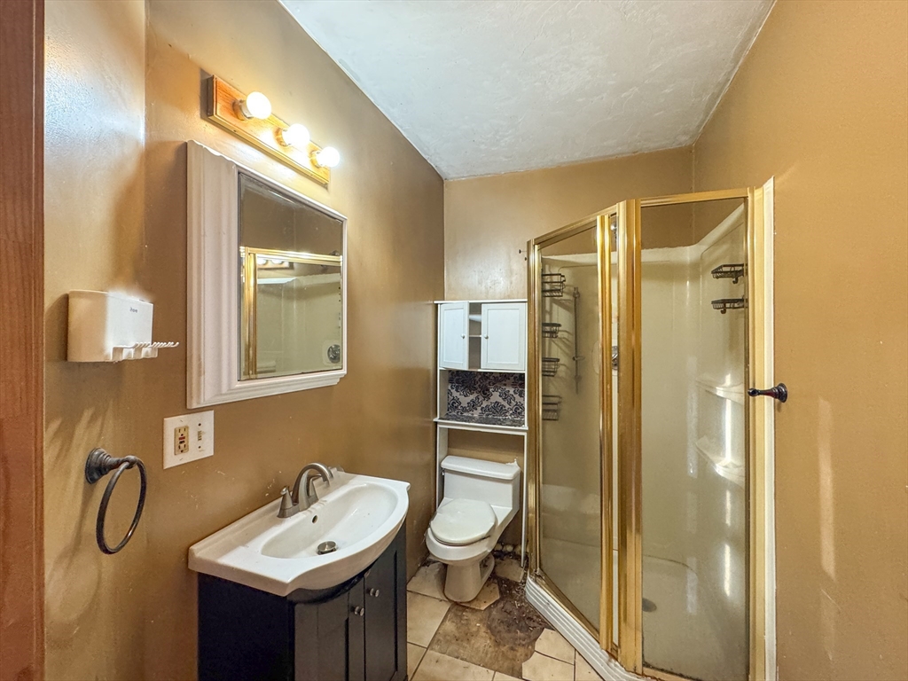 53 Miller Street Middleboro, MA 02346 - Photo 17 of 26 a bathroom with a sink toilet and shower