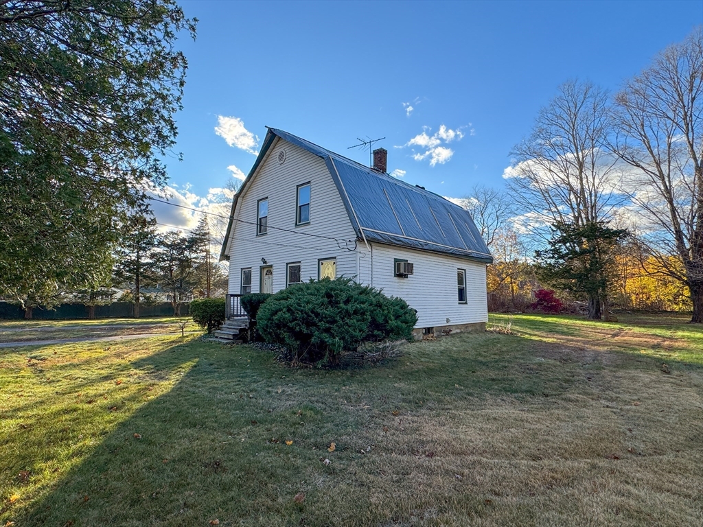 53 Miller Street Middleboro, MA 02346 - Photo 3 of 26 a view of a house with a yard and potted plants