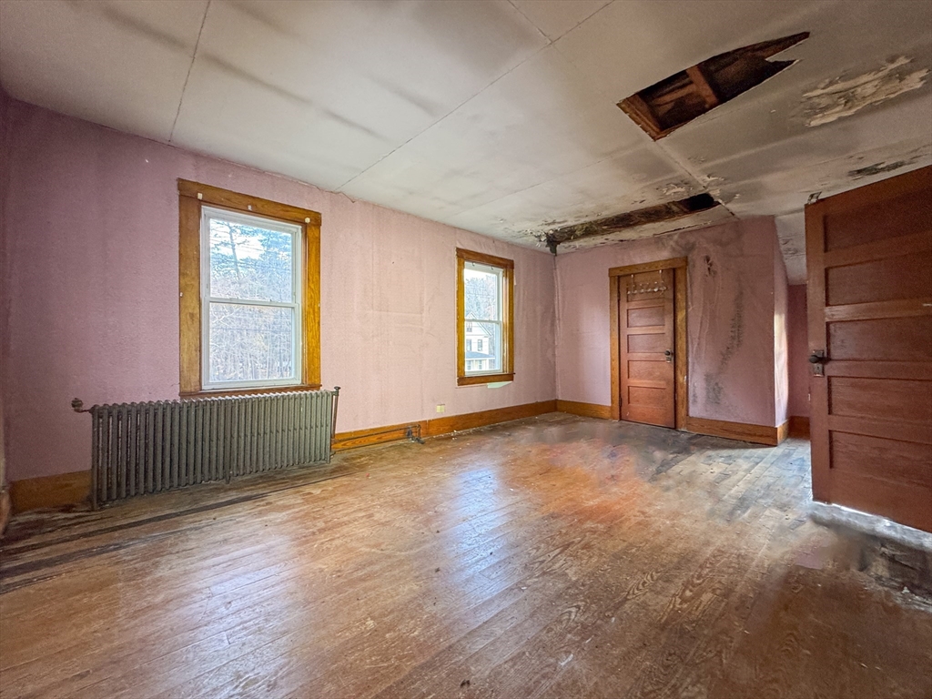 53 Miller Street Middleboro, MA 02346 - Photo 4 of 26 an empty room with wooden floor and windows
