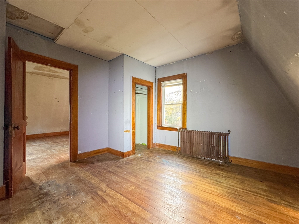 53 Miller Street Middleboro, MA 02346 - Photo 8 of 26 an empty room with wooden floor and windows