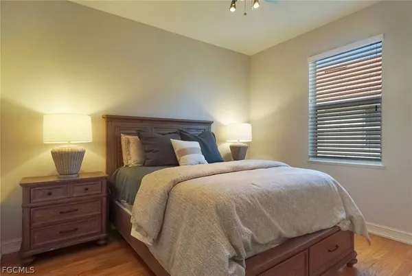 a bedroom with a bed and with furniture